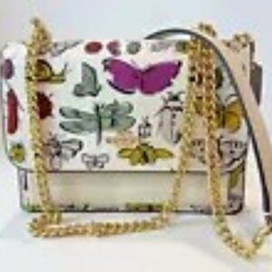 Coach Mini Klare Crossbody purse with bug print! Great for spring and summer!